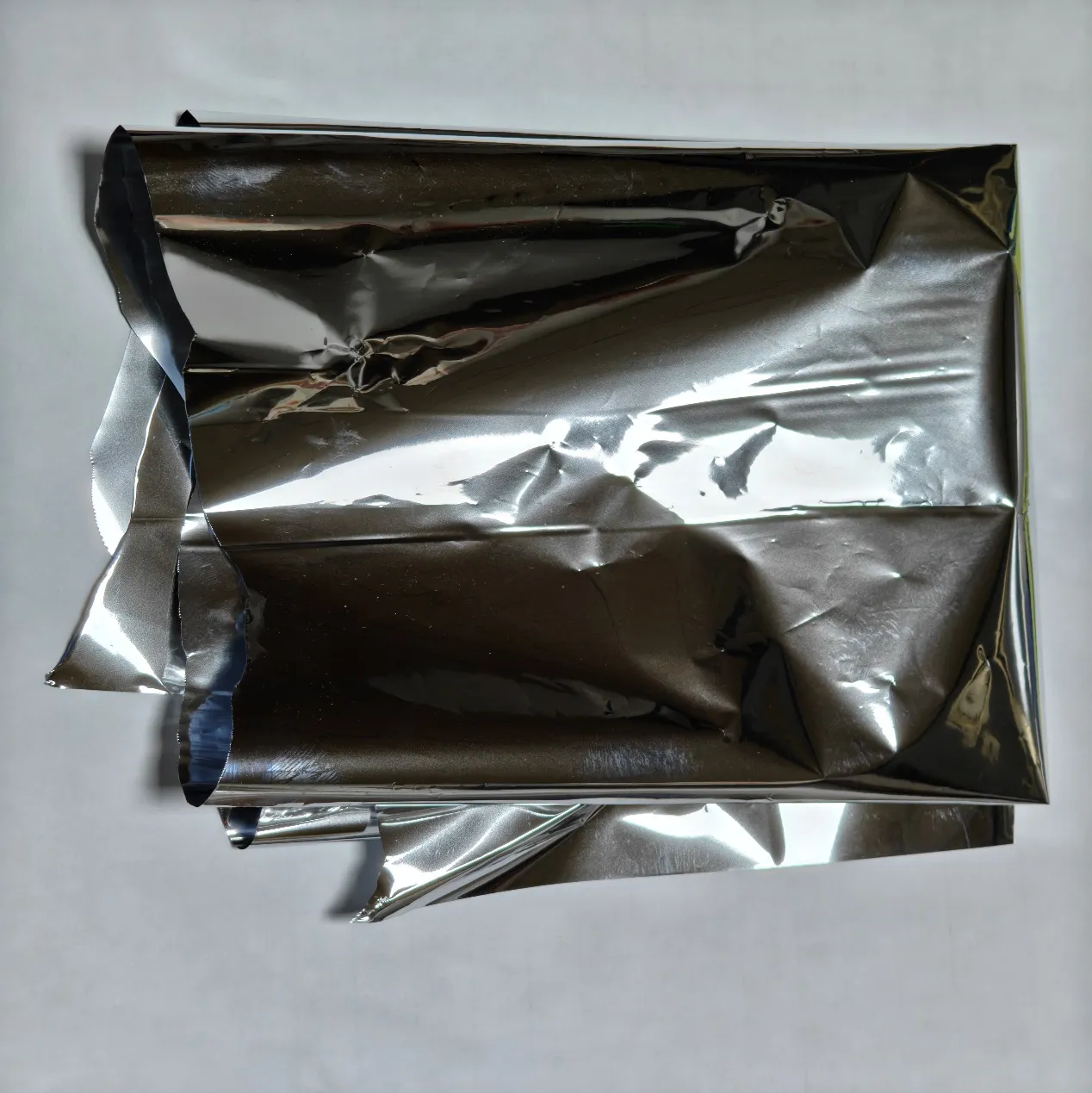 Aluminum composite layer materials in flexible packaging